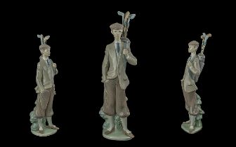Lladro Hand Painted Porcelain Figure' Golfer with Bag and Clubs ' Issued 1970 - 1999. Height 12