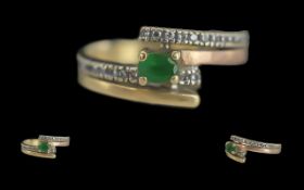 Ladies 14ct Gold Emerald and Diamond Set Ring. Marked 14ct to Interior of Shank. Set with 26 Well