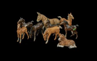 Collection of Seven Beswick Foals and a Beswick Donkey, and a Doulton foal.
