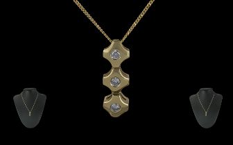 Ladies Contemporary Design Three Stone Diamond Set Pendant Drop with attached 18ct gold chain,