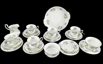 Richmond Bone China Tea Set 'Blue Poppy', comprising seven trios of cup, saucer and side plate, a