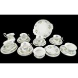 Richmond Bone China Tea Set 'Blue Poppy', comprising seven trios of cup, saucer and side plate, a