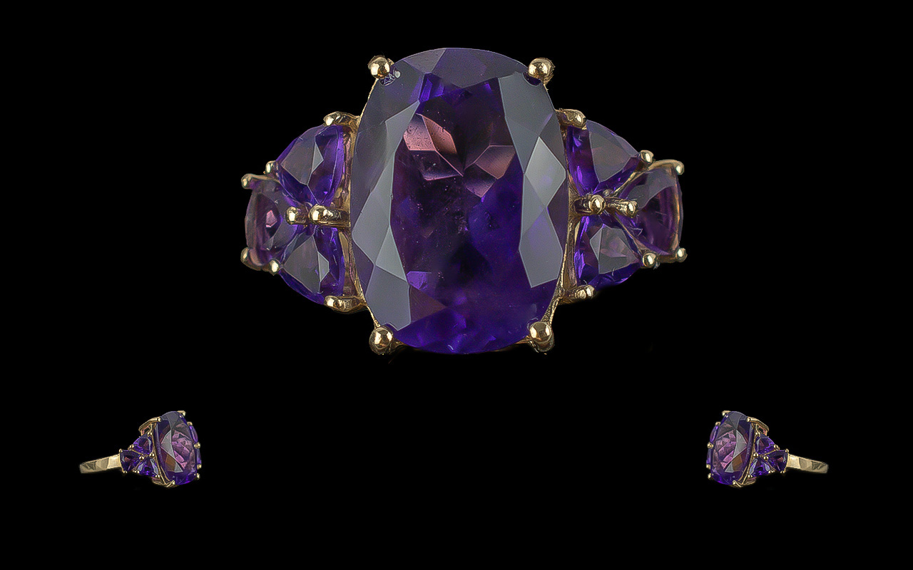 Ladies 18ct Gold Attractive Amethyst Set Dress Ring. Marked 9ct to Interior of Shank. The Large