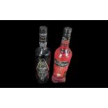 Two Bottles of Sambuca, one raspberry and one liquorice, together with ten miniature bottles of