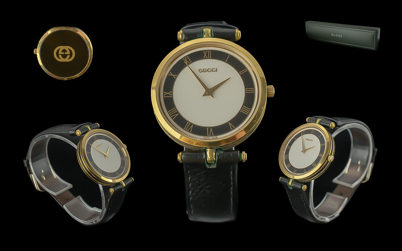 Gucci - Ladies or Gents Gold Plated and Black Enamel Quartz Wrist Watch. Diameter of Dial 35mm, With