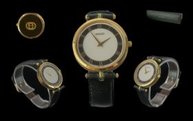 Gucci - Ladies or Gents Gold Plated and Black Enamel Quartz Wrist Watch. Diameter of Dial 35mm, With
