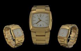 Gentleman's Gucci Quartz Wristwatch, gold plated, date aperture. White face, gold baton markers.