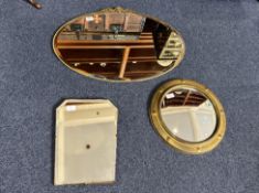 Three Vintage Mirrors, comprising an oval mirror 29'' wide x 21'' high with decorative finial, a