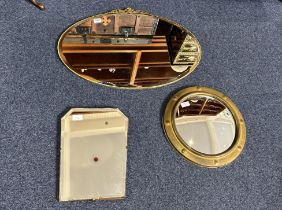 Three Vintage Mirrors, comprising an oval mirror 29'' wide x 21'' high with decorative finial, a