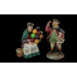 Two Royal Doulton Figures, comprising HN2119 'Town Crier' and HN1315 'The Old Balloon Seller'.