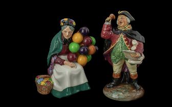 Two Royal Doulton Figures, comprising HN2119 'Town Crier' and HN1315 'The Old Balloon Seller'.