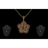 Ladies 14ct Gold Beverley Hills Fancy Open worked Pendant, set with orange garnets. Attached to a