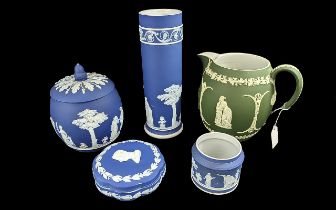 Collection of Wedgwood, comprising Dark Blue Jasper biscuit barrel, lidded trinket box, tall 10''
