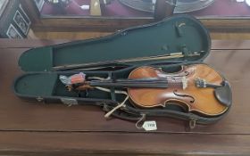 A Late 19th/Early 20th Violin, one piece back, in playable order, with bow. In fitted case.