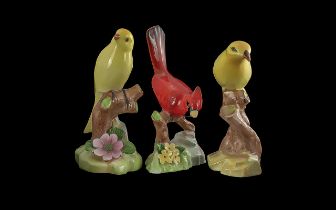 Three Vintage Raybur Staffordshire Bone China Tropical Bird Figures, a yellow canary, a red Cardinal