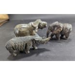 Three Cast Animal Figures, comprising a buffalo, a rhinoceros, and an elephant. Tallest measures 6''