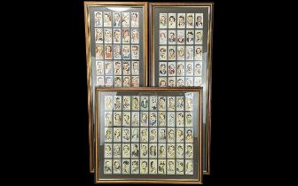 Three Framed Collections of Cigarette Cards, comprising Film Stars First Series - complete 50 cards,