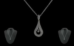 Ladies - Excellent 18ct White Gold Diamond Set Pendant Attached to a 18ct White Gold Chain. The 24