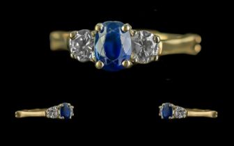 14ct Gold Three Stone Ring, Central Sapphire set between two brilliant cut diamonds, est.