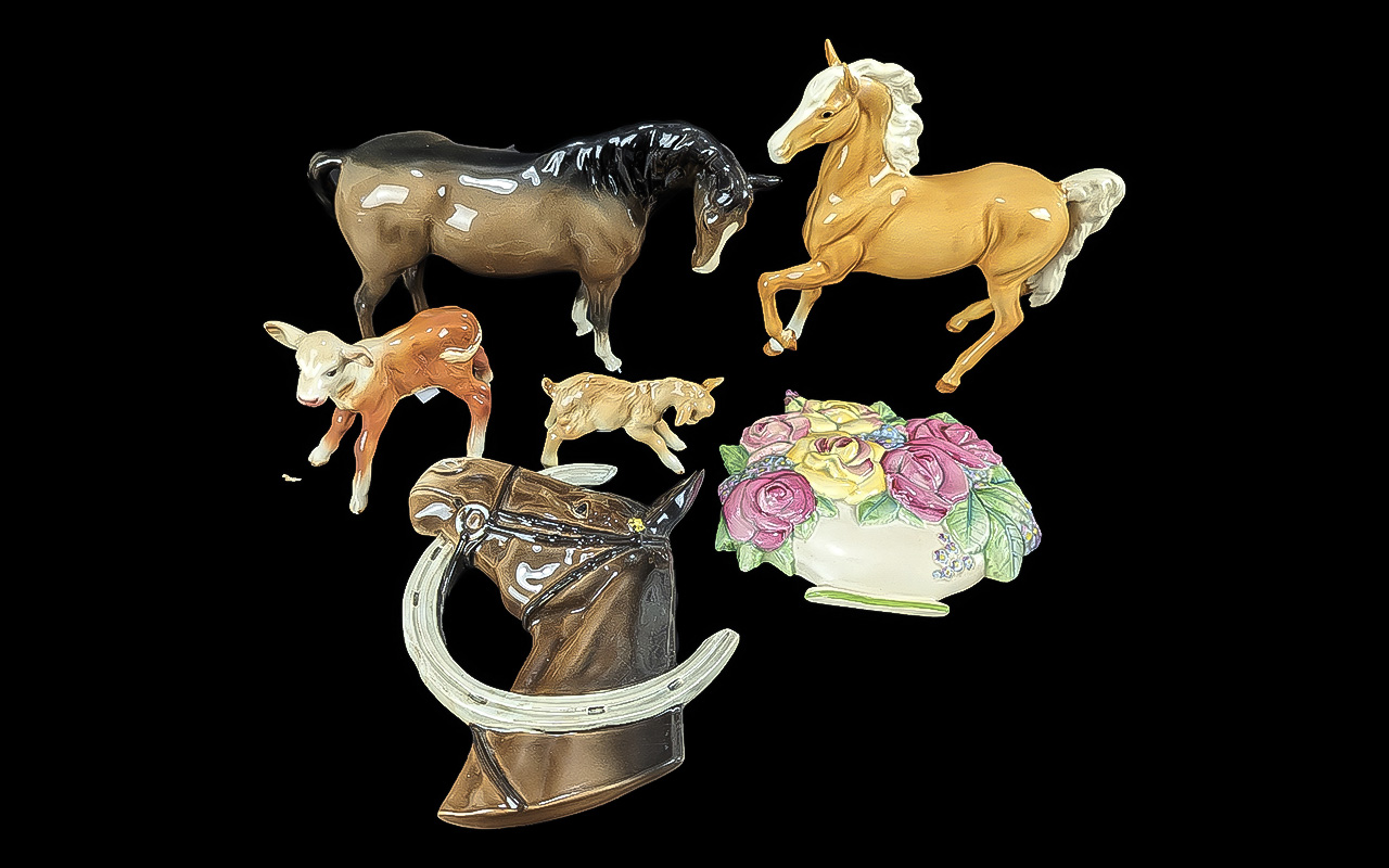 Collection of Beswick Figures, including a dark drown horse figure, a Palomino horse figure, two