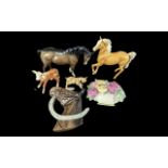 Collection of Beswick Figures, including a dark drown horse figure, a Palomino horse figure, two