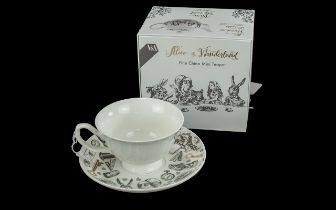 V & A Alice In Wonderland China Mini Teapot, with matching tea cup and saucer.