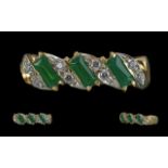 14ct Gold - Contemporary Designed Diamond and Emerald Set Dress Ring. Marked 585 - 14ct to Shank.