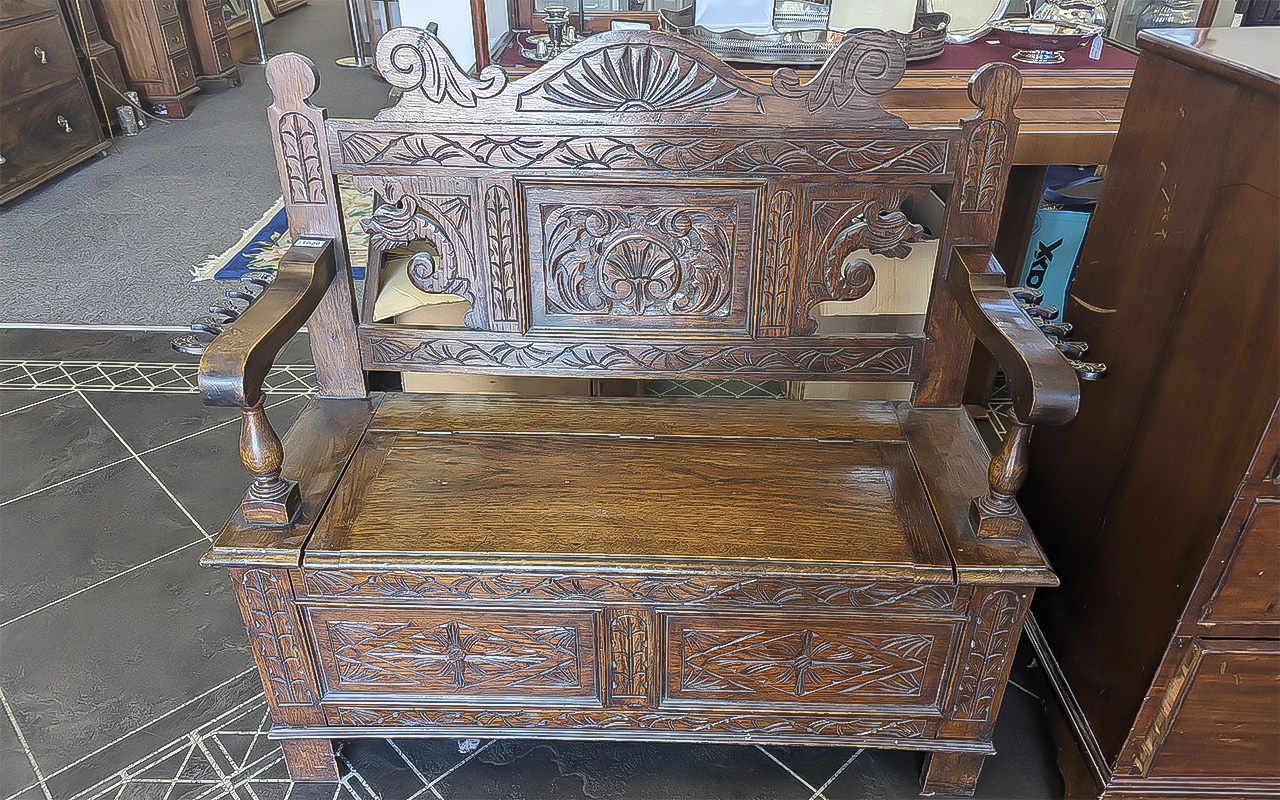 Early 20th Century Oak Monk's Bench, two seater, typical form, carved panels throughout, hinged