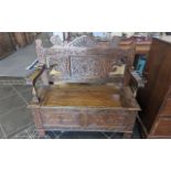 Early 20th Century Oak Monk's Bench, two seater, typical form, carved panels throughout, hinged