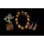 Set of Amber Jewellery, comprising a tri-colour expanding bracelet, a square pendant suspended on