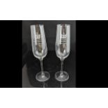 Pair of Dartington Glass Champagne Flutes engraved 'To Commemorate the engagement of HRH Prince