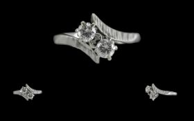 Ladies Attractive 18ct White Gold Two Stone Diamond Set Ring. Full hallmark to interior of shank.