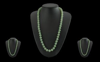 A 1930's Pleasing Jade Beaded Necklace - Well Matched. Length 23'' (57.5 cm) Weight 75.9 grams.