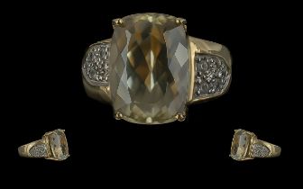 9ct Gold Kunzite Ring, large central stone, shoulders set with white sapphires. Ring size K.