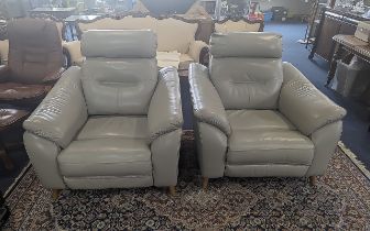 Two Electric Reclining Chairs, grey leather armchairs.