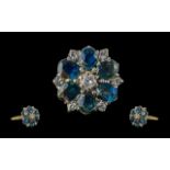 Ladies 9ct Sapphire & Diamond Flowerhead Ring, centre diamond surrounded by six oval sapphires