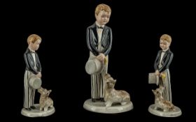 Goldschider hand painted figure ' boy with top hat ' and tails, striped trousers with small dog.