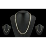 A Good Quality Single Strand Cultured Pearl Necklace, well matched with good lustre. the 9ct gold