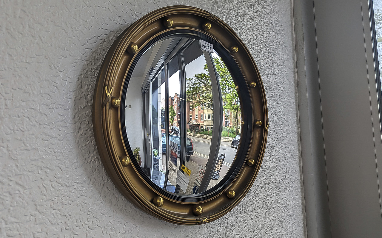 Mid Century Concave Mirror with baubles for decoration, approx. 17'' x 17''.