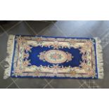 Chinese Wool Runner, measures 5' x 2.6', dark blue background with floral pattern and fringing. 100%