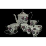 Royal Albert 'Masquerade' Tea Set, comprising teapot, six cups and saucers, and sugar bowl.