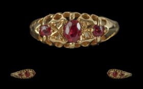 George V - Pleasing 18ct Gold Ruby and Diamond Set Ring. The Rubies of Excellent Rich Colour with