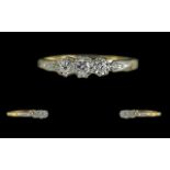 18ct Gold and Platinum 3 Stone Diamond Set Ring, Illusion Set. The Round 3 Faceted Diamond of