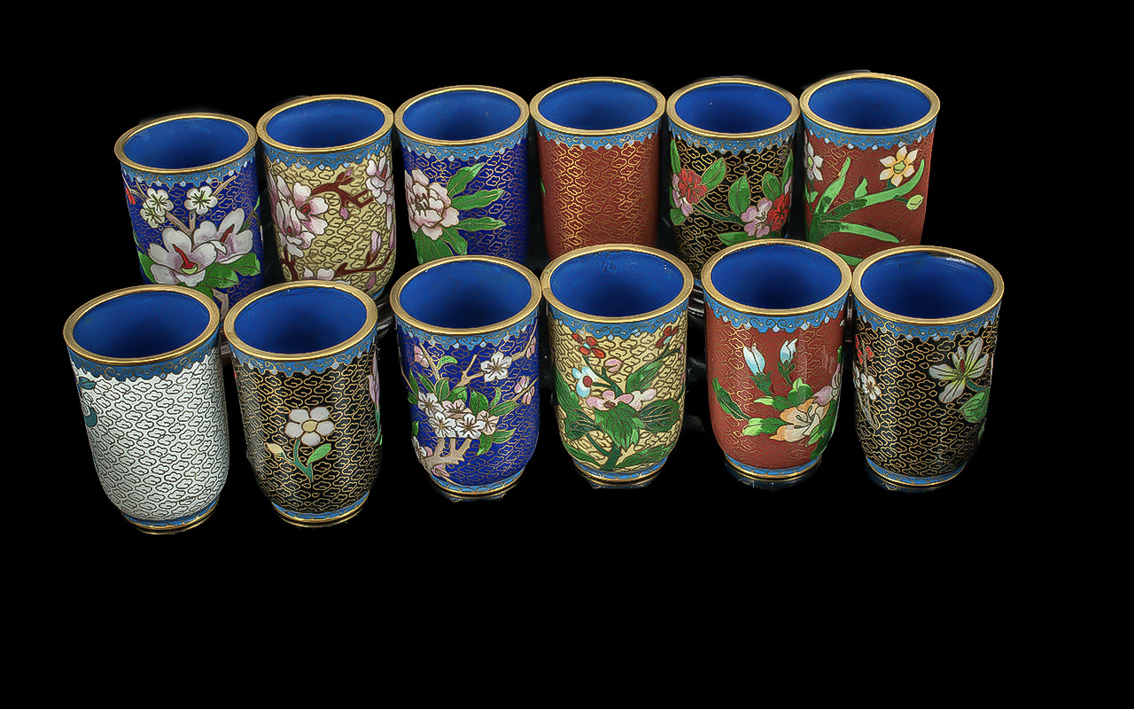 Box of Twelve Oriental Cloisonne Coffee/Tea Cups, no handles, with wooden stands, assorted colours