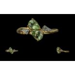 18ct Gold Ladies Dress Ring, two central pale green pear shaped stones with diamond shoulders.