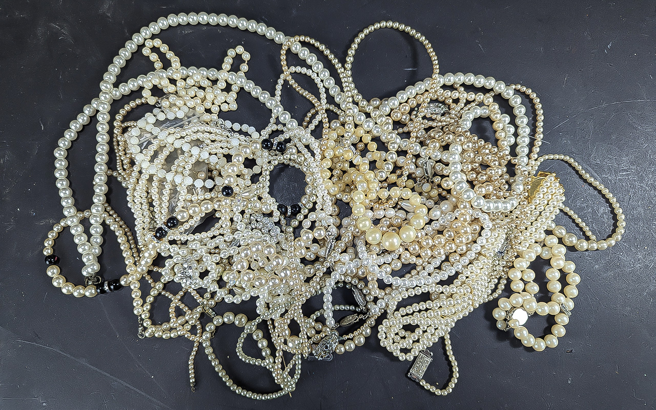 Pearl necklaces. large bag of pearl necklaces.