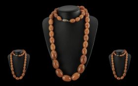 An Excellent Quality Early 20th Century Butterscotch Amber Graduated Beaded Necklace, Excellent