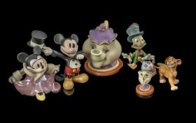 Walt Disney Collectors Club Figures, comprising Mickey and Minnie Mouse, Simba, Mrs. Potts and Chip,