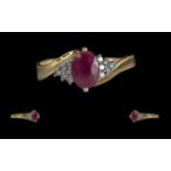 Ladies - Attractive Ruby and Diamond Set Ring. Full Hallmark to Interior of Shank. The Oval Shaped