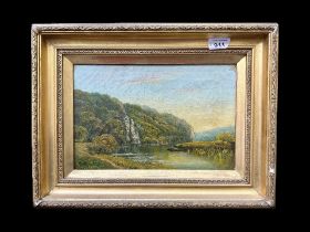 Oil on Canvas, indistinct signature, lake scene with boat and figures. Framed in gilt swept frame.